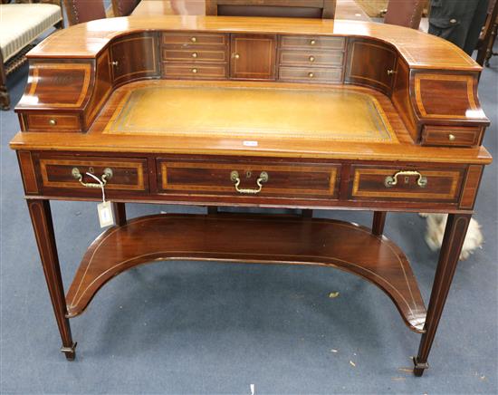 A Carlton House style inlaid mahogany desk, W.114cm